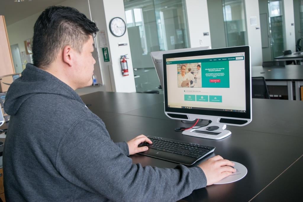 Louis Wei sending letters on a computer