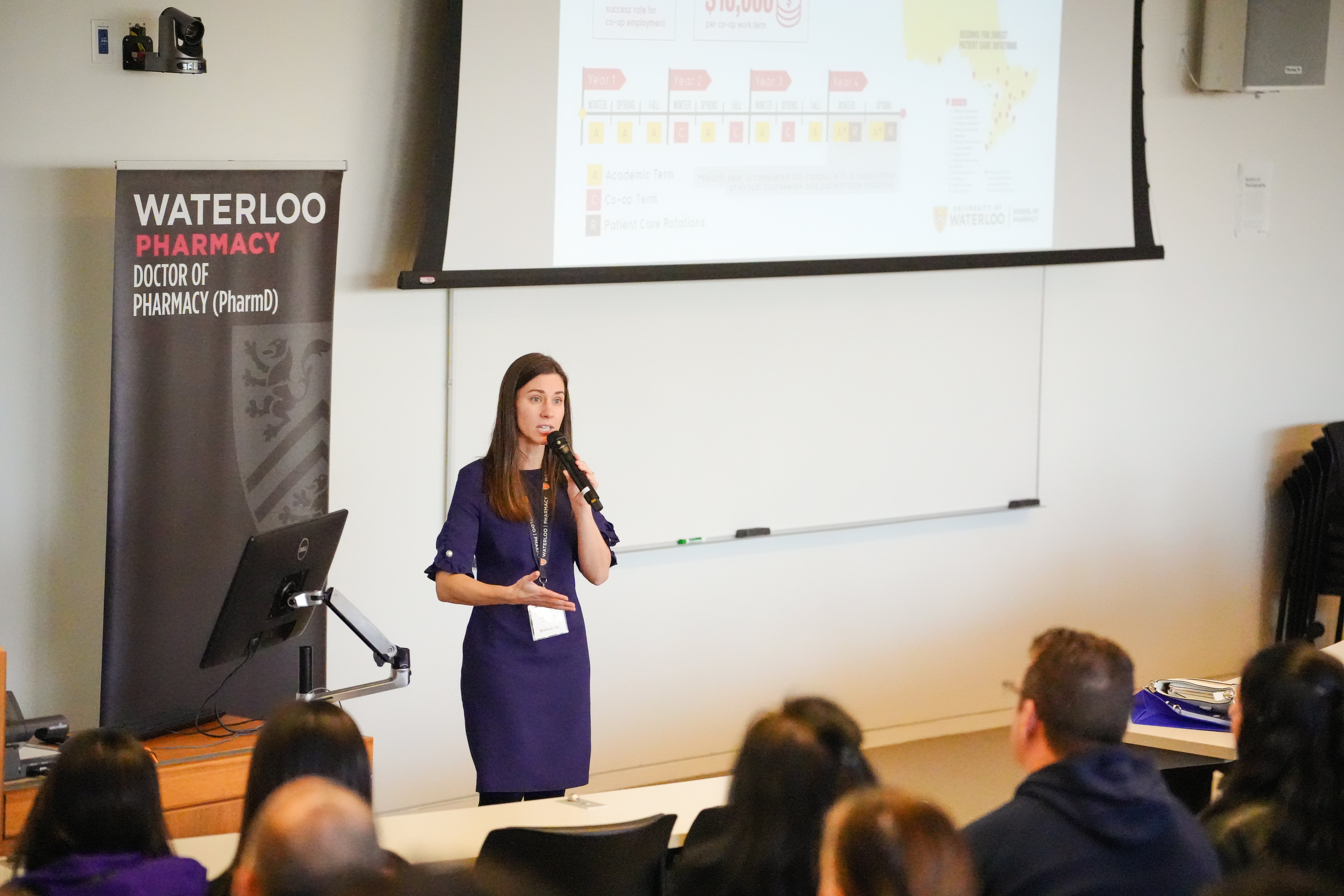 Kaitlin Bynkoski, Director of Admissions & Undergraduate Affairs, speaking with future students and their famillies