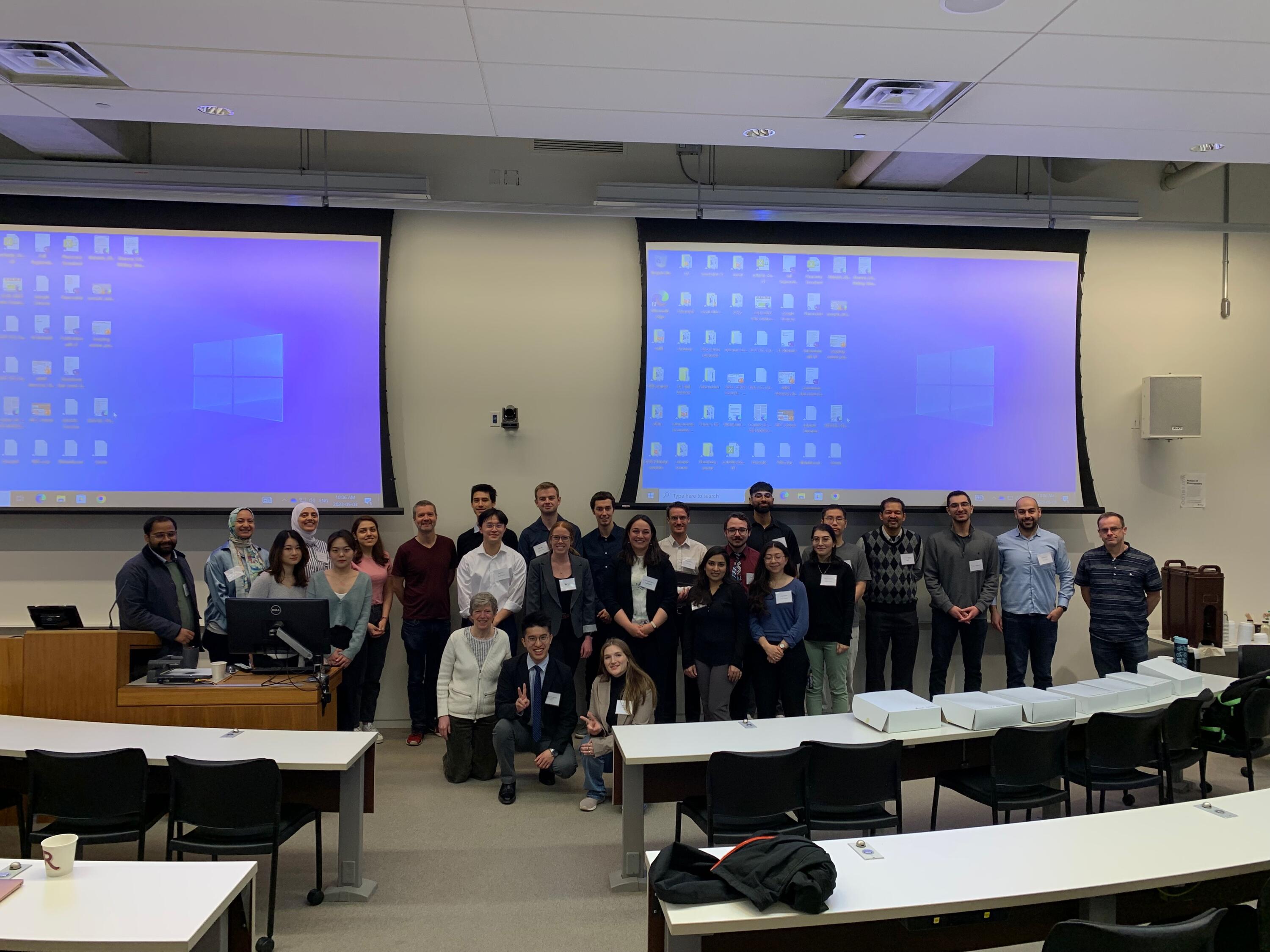 A group of people in front of a classroom