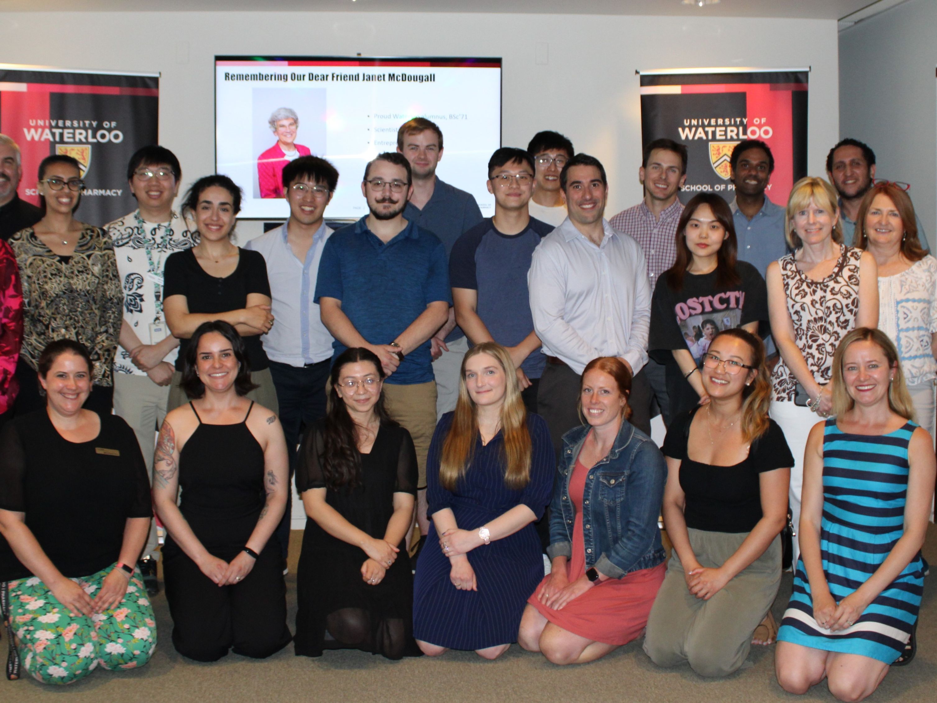 A group of students and faculty smiling