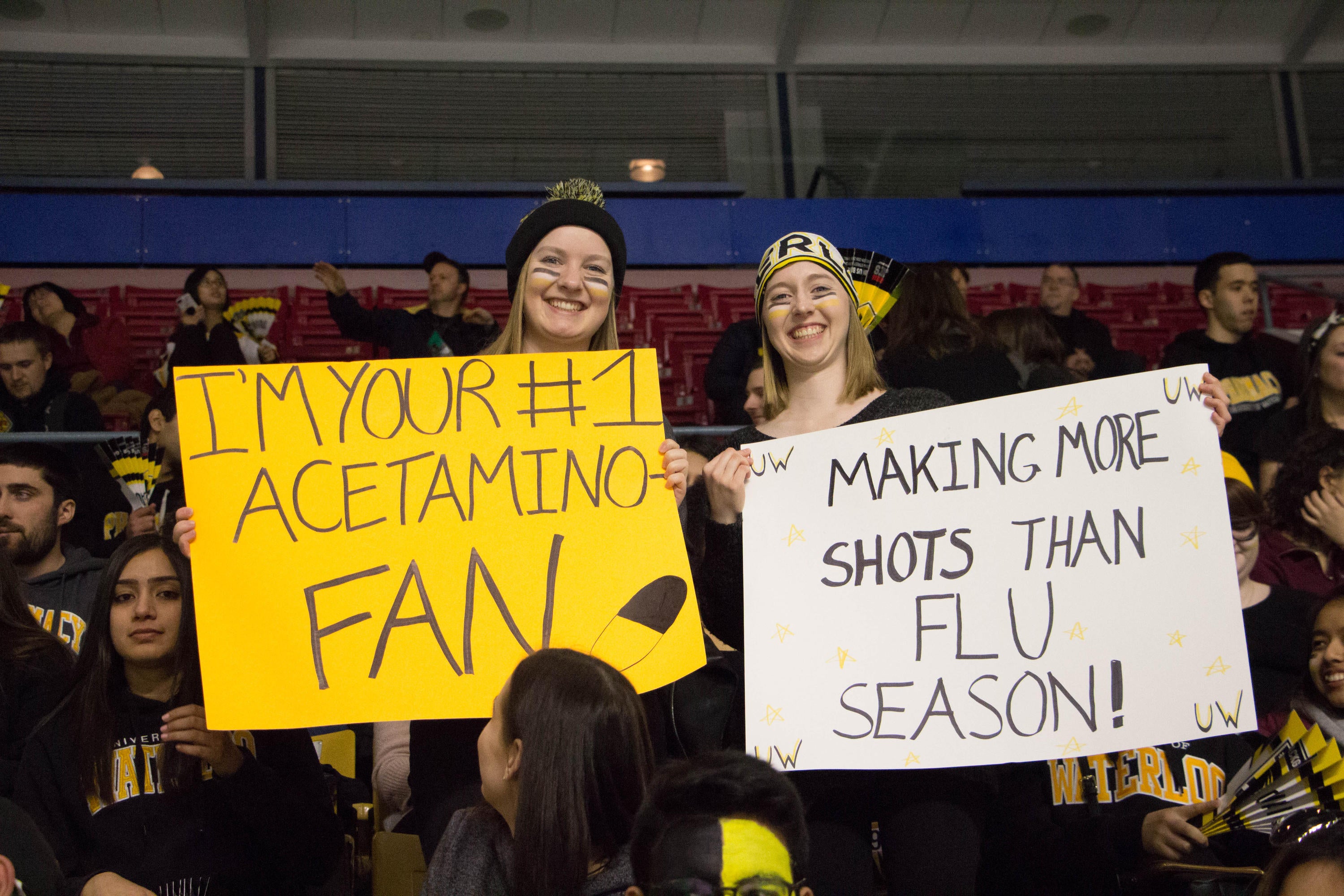 Fans with pharmacy themed signs