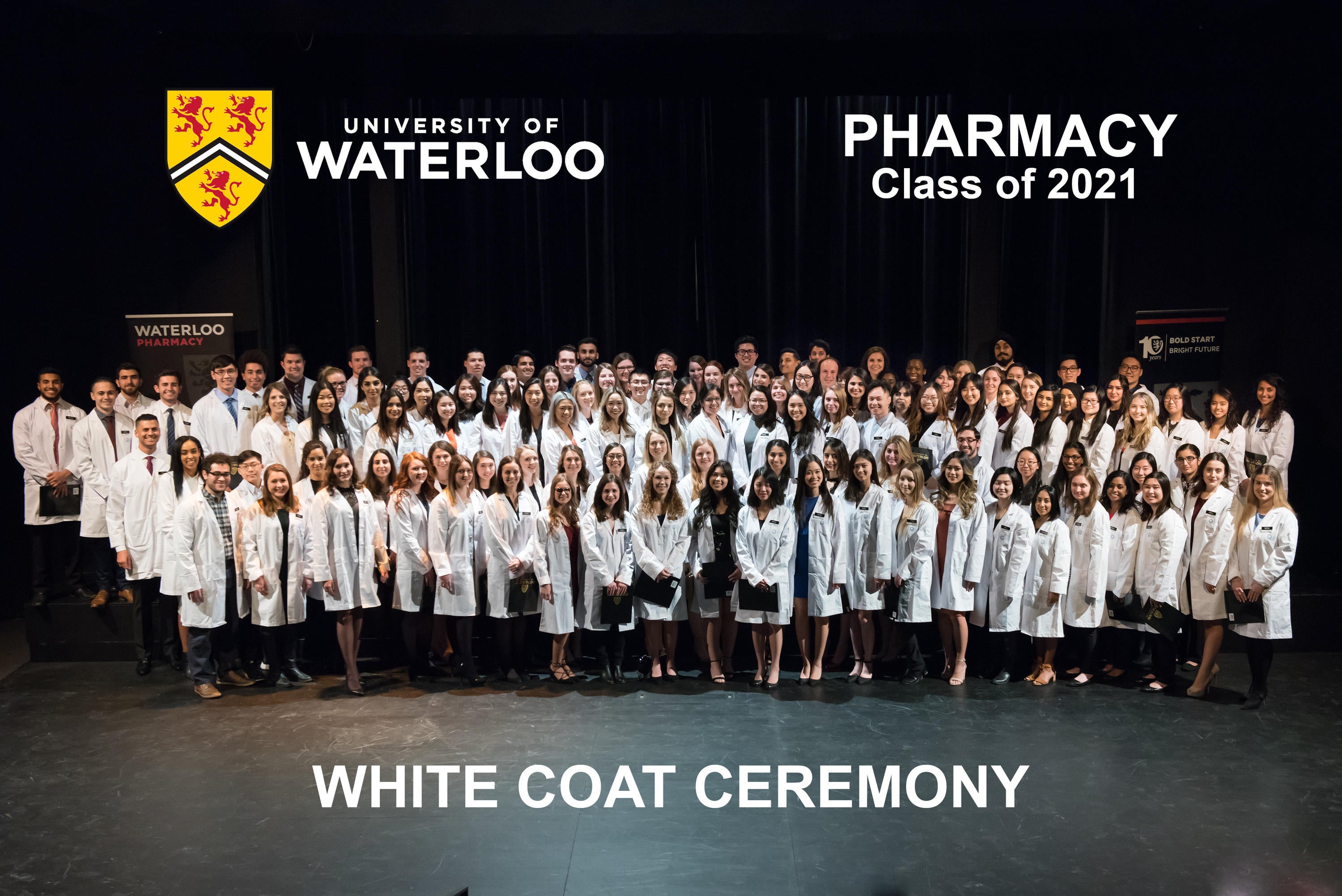 Rx2021s at their white coat ceremony in their new coats on stage