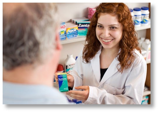 Pharmacist presenting medication to customer