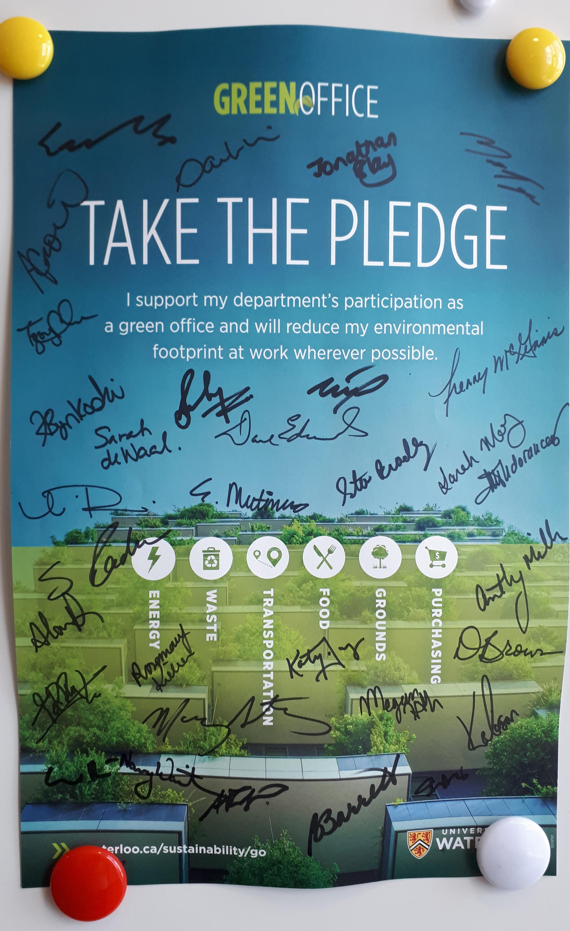Green Office Pledge Poster with signatures from staff and faculty