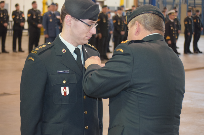 Art receiving a Canadian Forces Decoration Medal from the Commanding Officer of 1 Canadian Field Hospital.