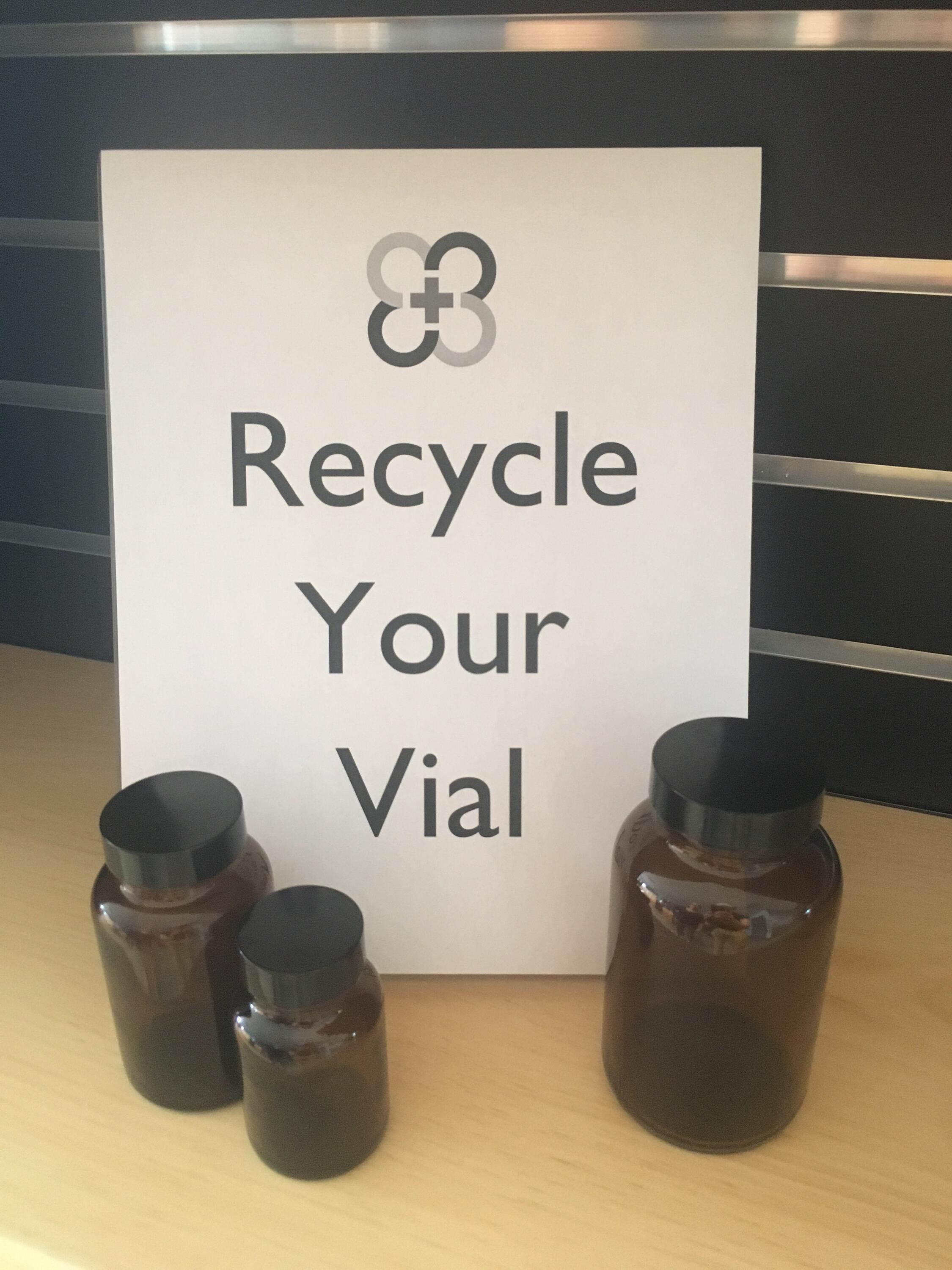 Recycle your vial sign with three amber glass vials