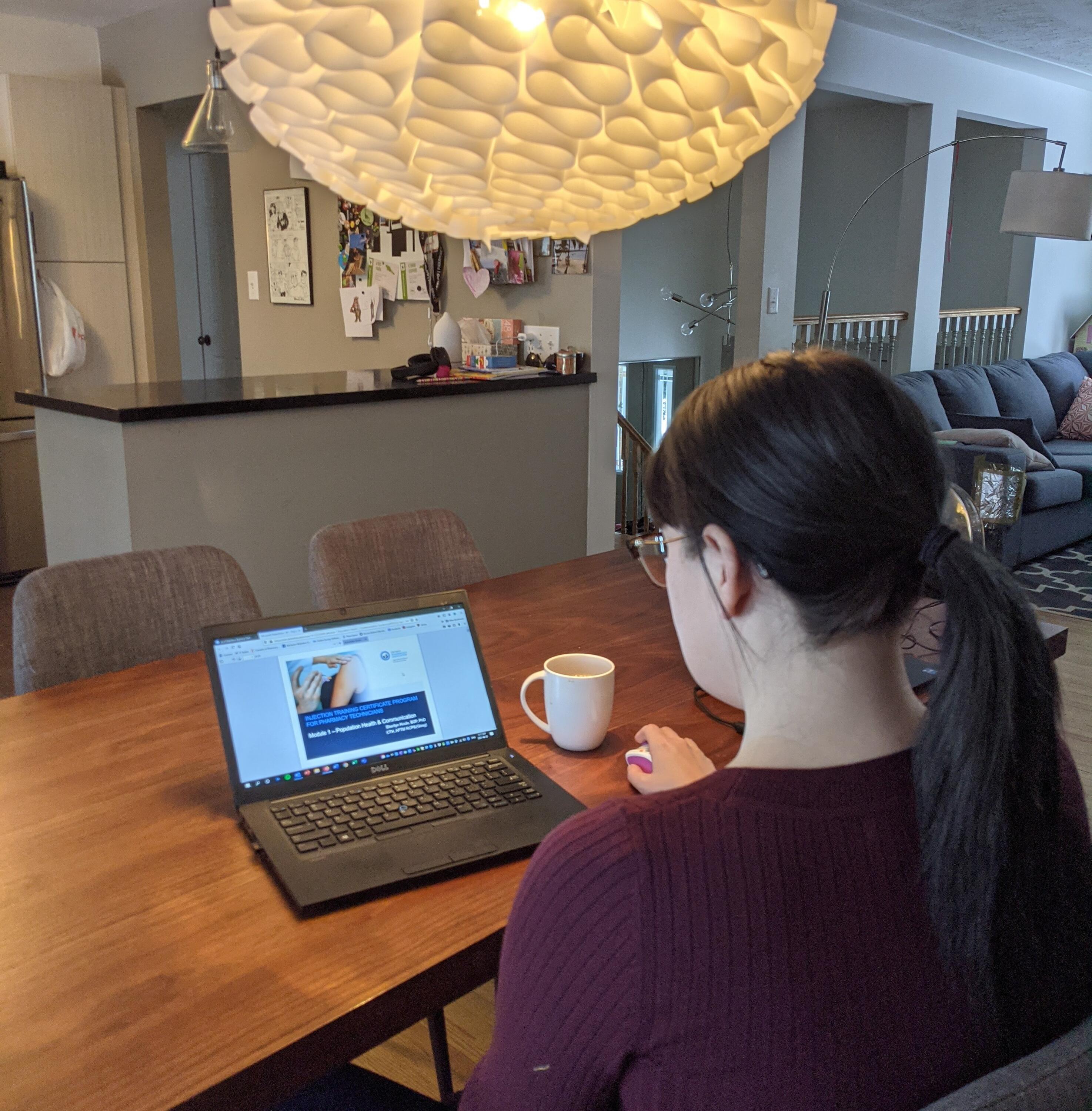 Robin Andrade at home completing the injections onlien course component on her laptop