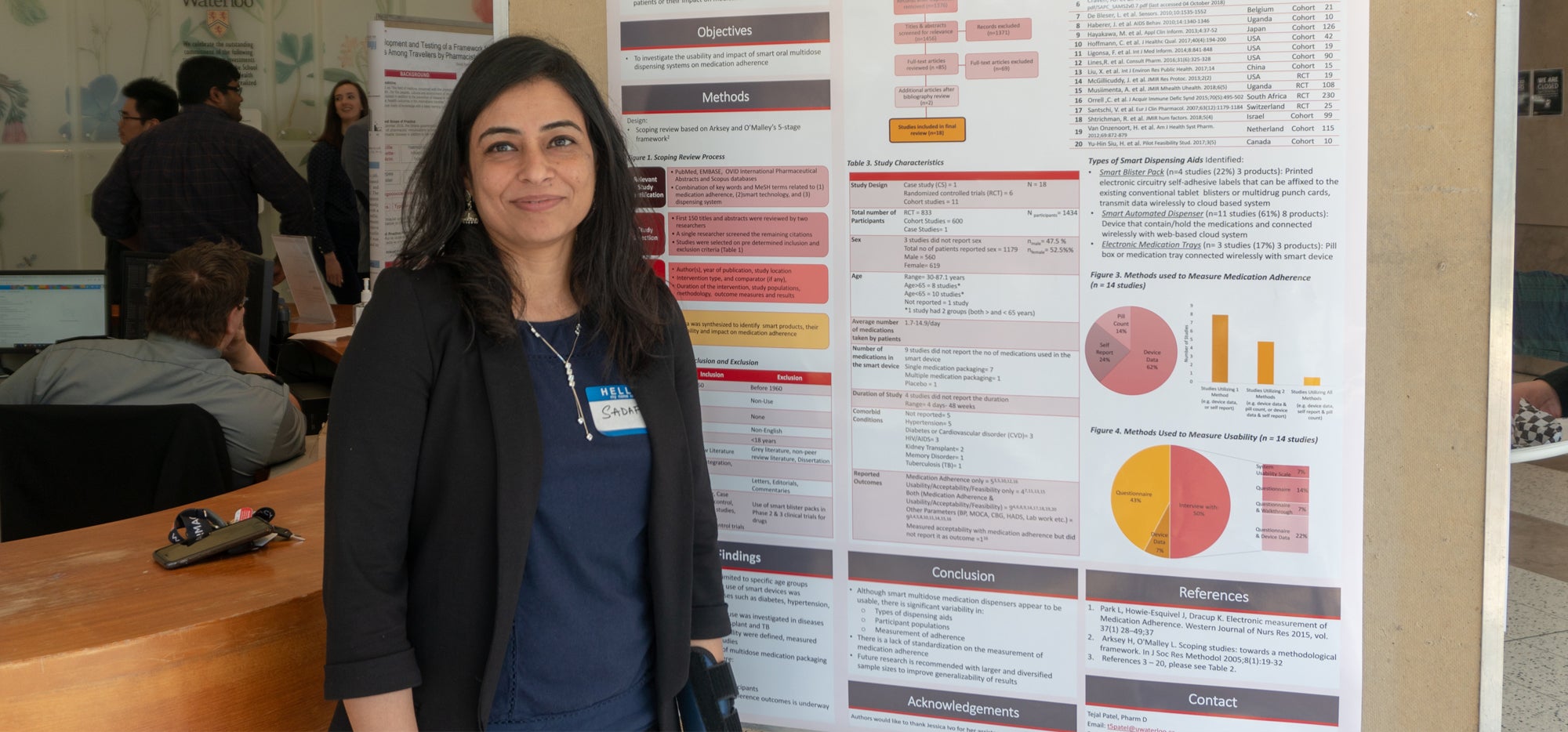 Sadaf in front of a research poster