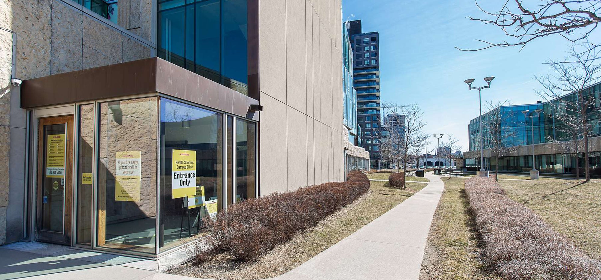 School of Pharmacy with signage for health care clinic