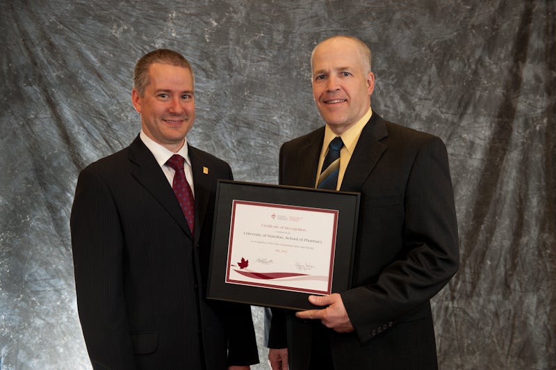 Ken Potvin Receives Award from Jody Shkrobot