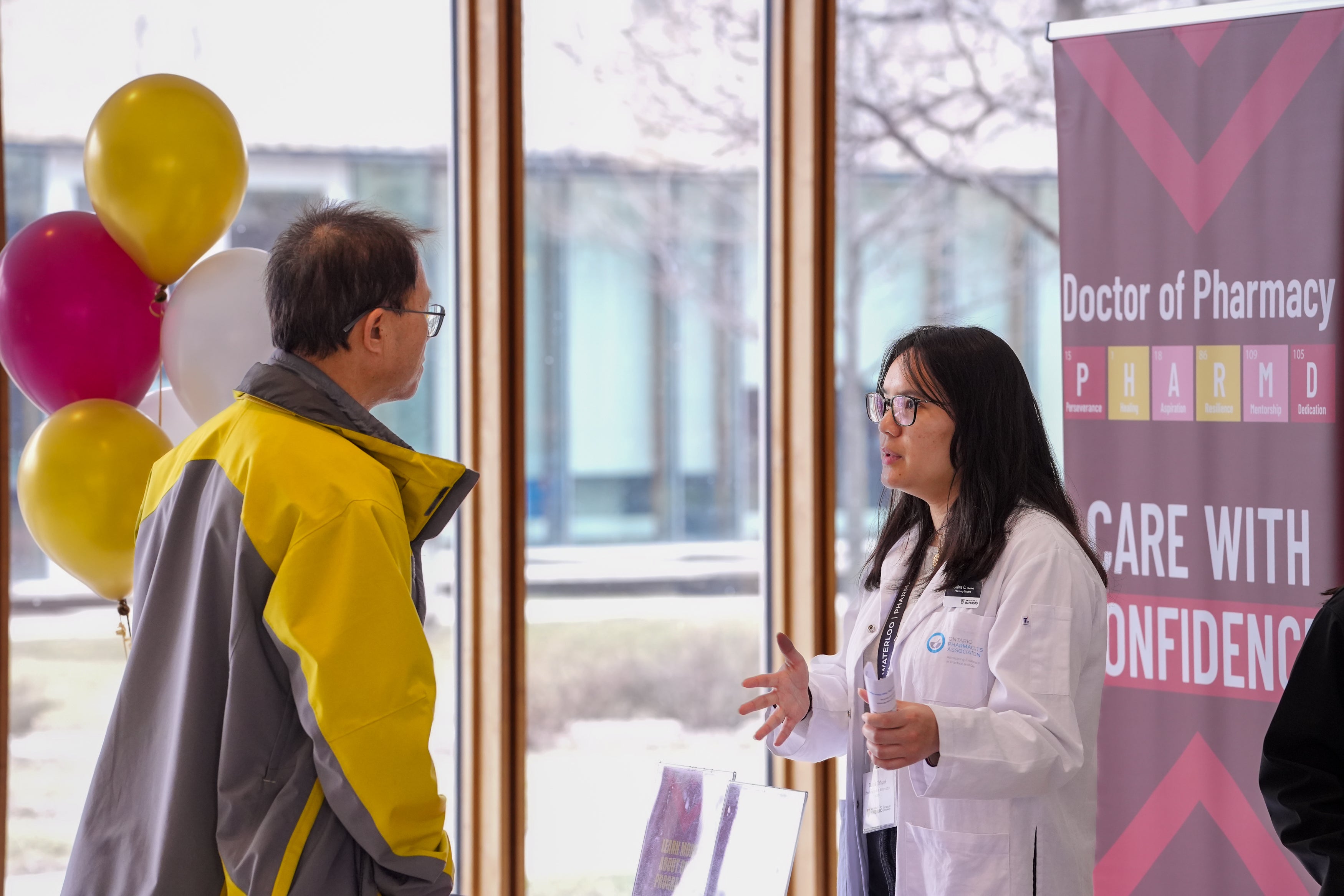 Ambassador talking to parent at open house