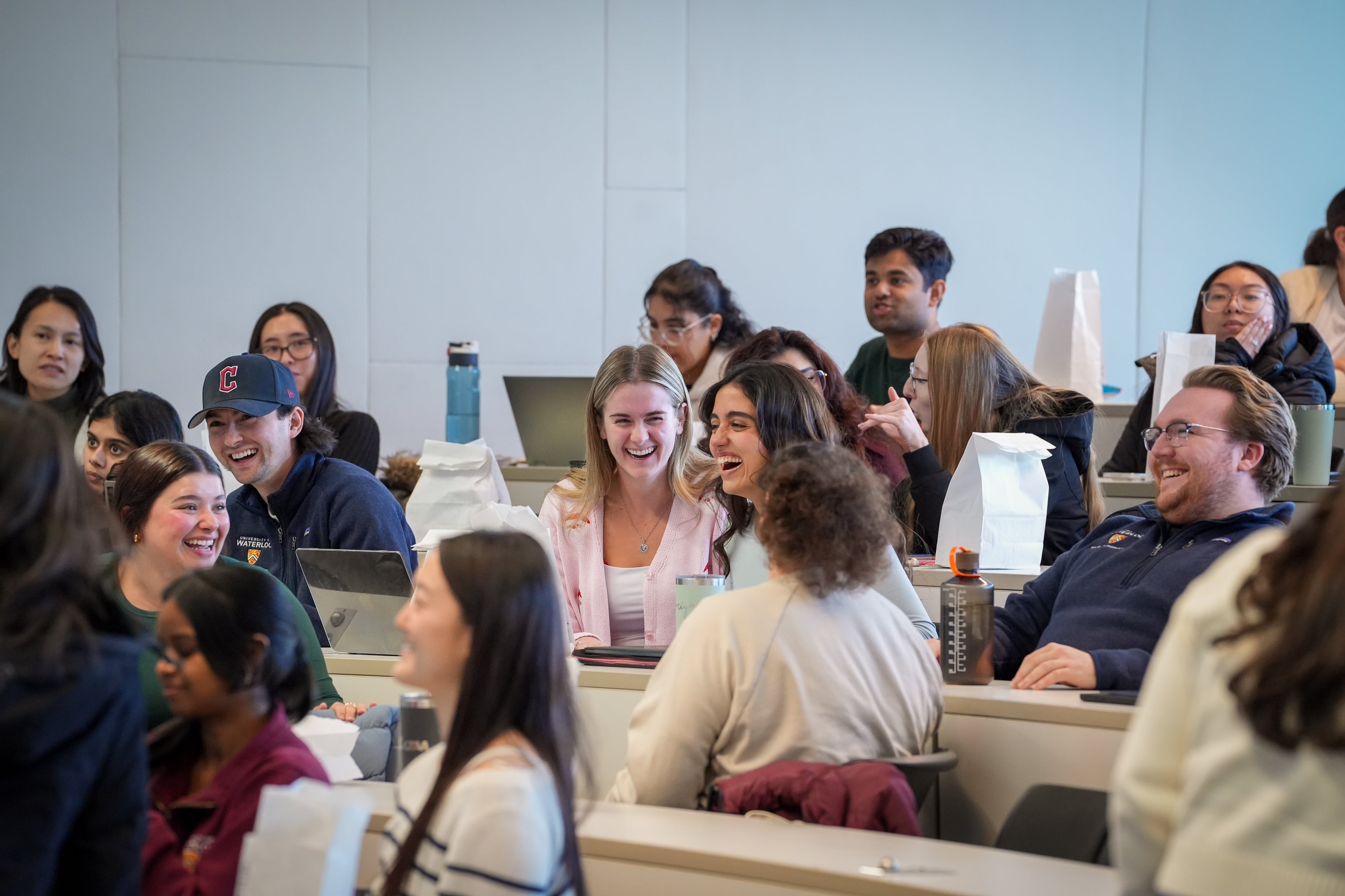 A classroom full of students smiling and laughing