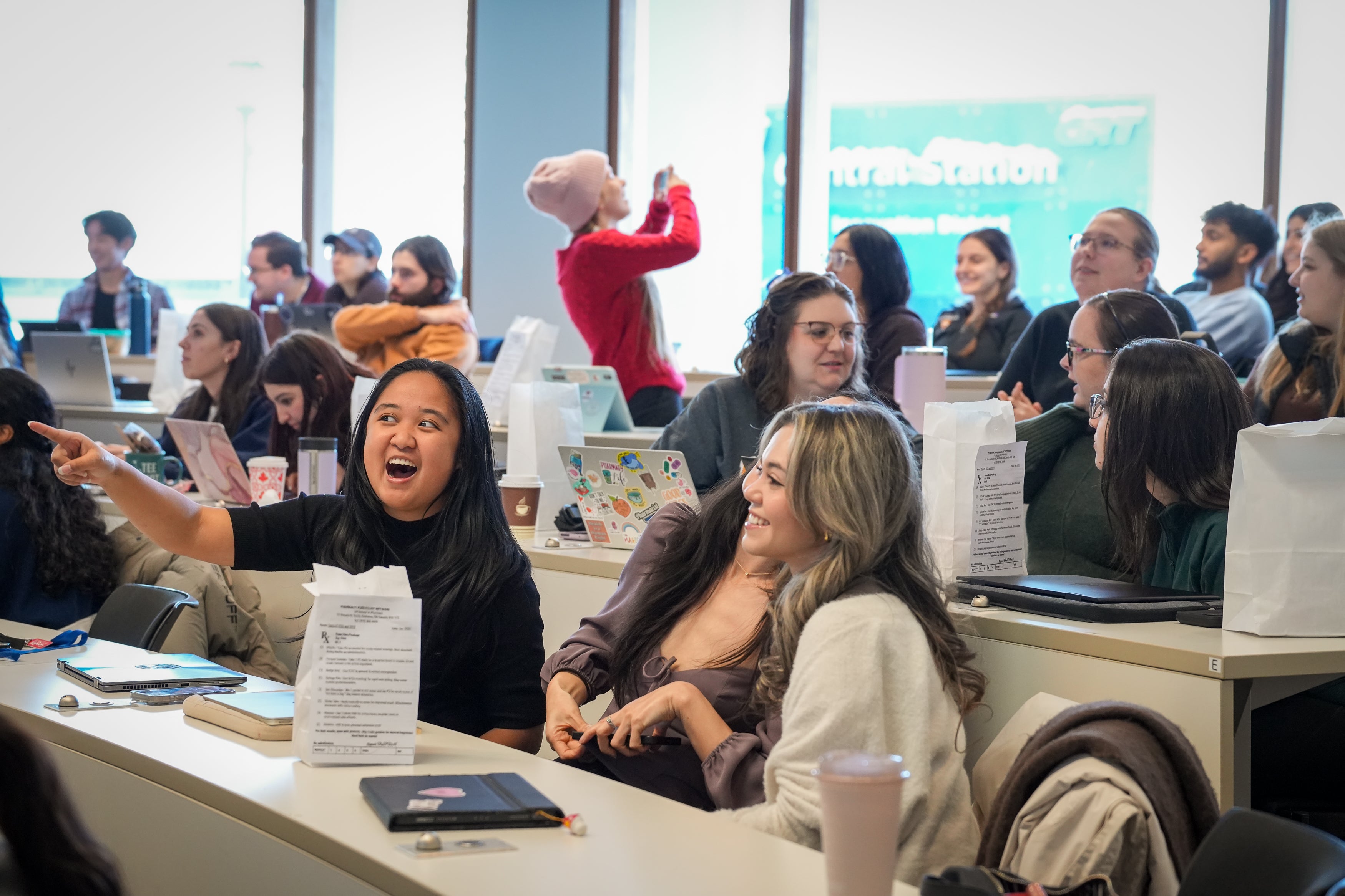 A classroom full of students smiling and laughing