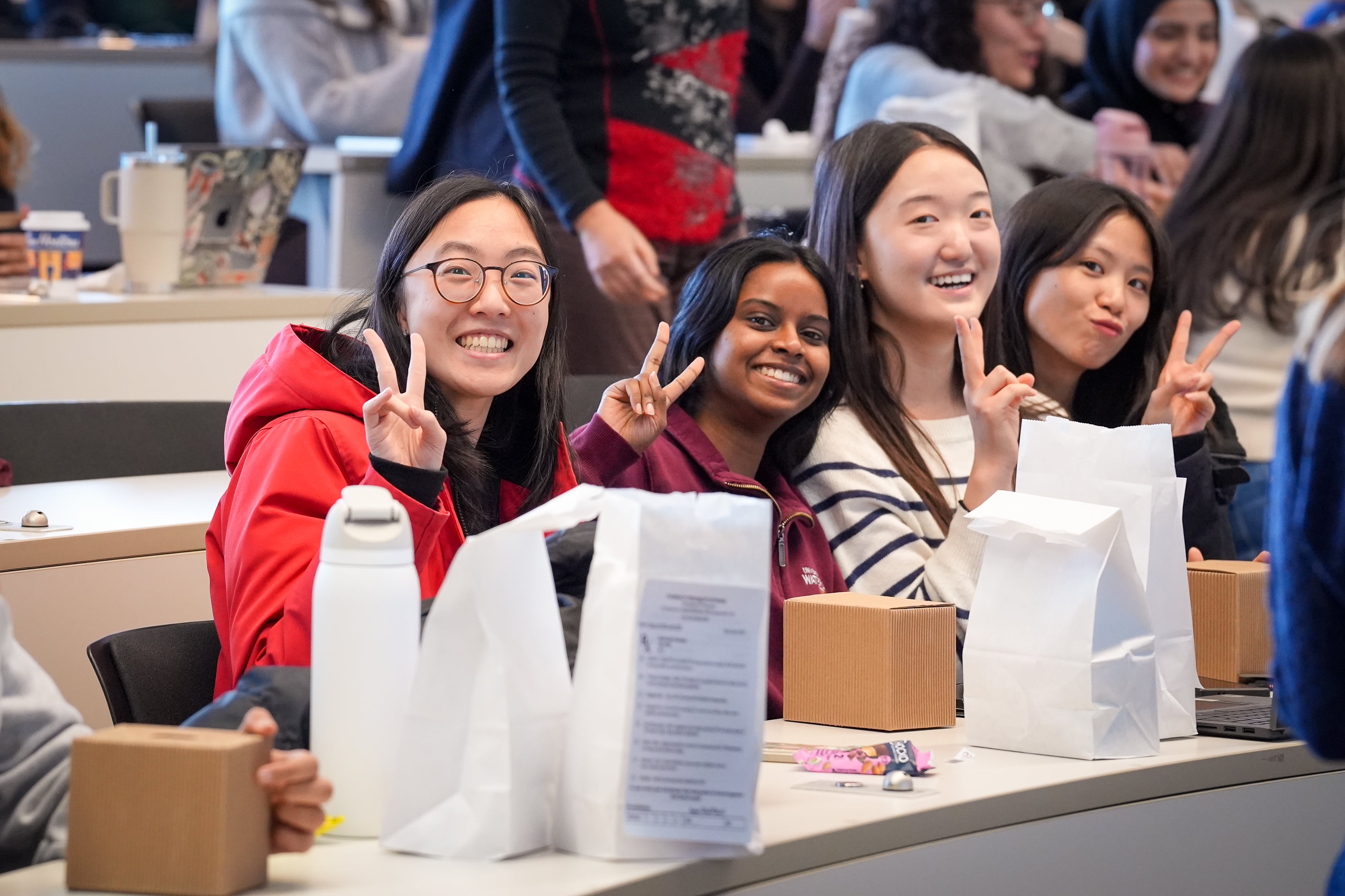 Students smiling in a classroom