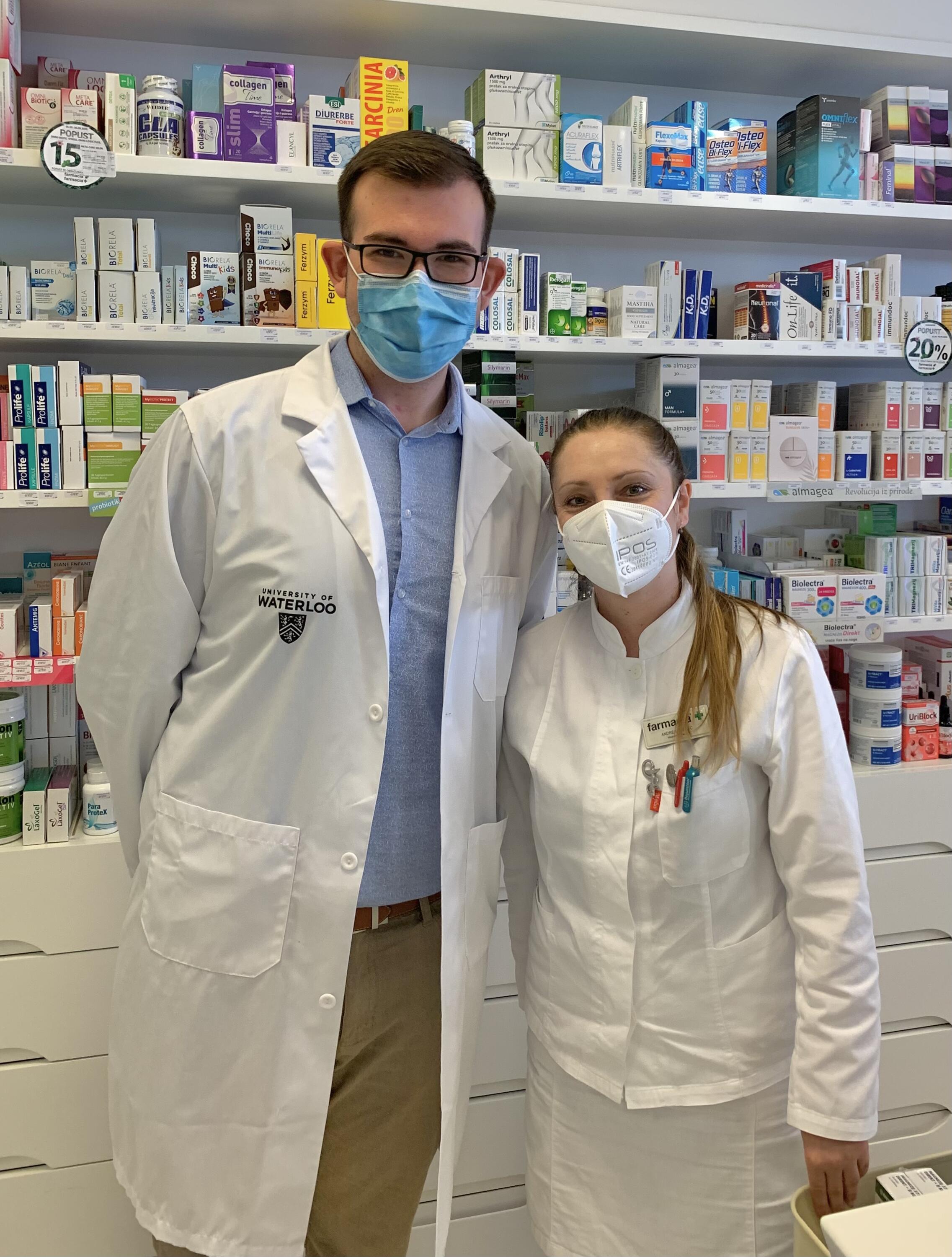 two pharmacists with masks on