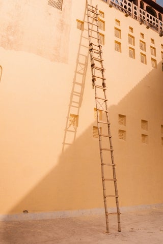 a ladder leaning against a wall
