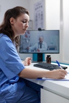 Healthcare worker at computer