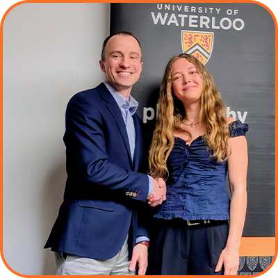 Matt Doucet presenting to Tessa Papastergiou