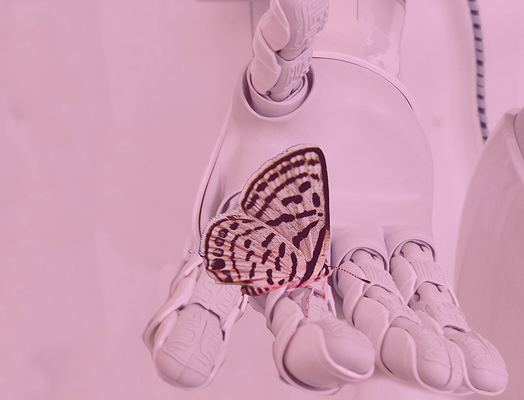 a robot hand with a butterfly resting on the finger