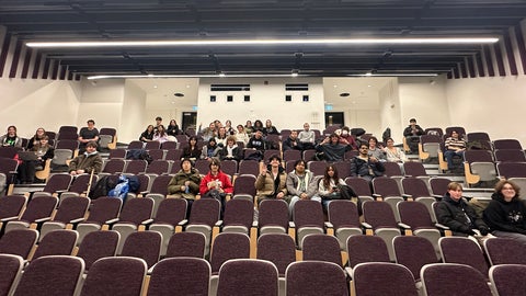Phys Club members getting ready to watch the show.
