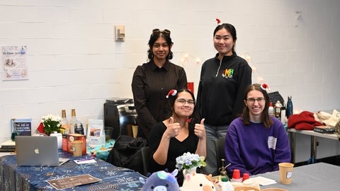 Fem Phys members hosting the end-of-term Study Cafe for the club.