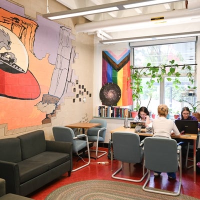 Fem Phys room with four students studying at a table.