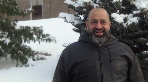 Firas Mansour standing outdoors in winter