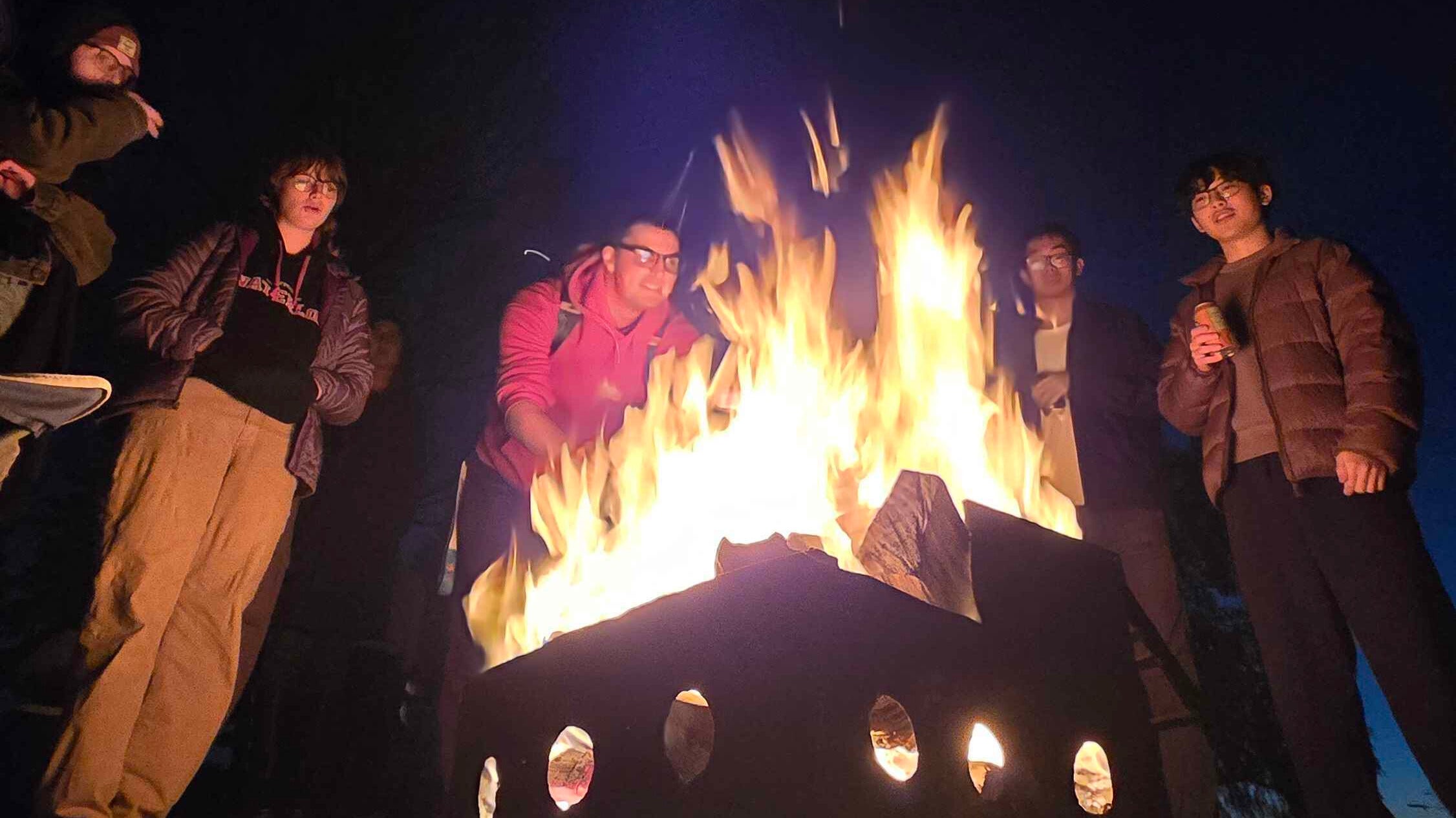 Students around a bonfire.