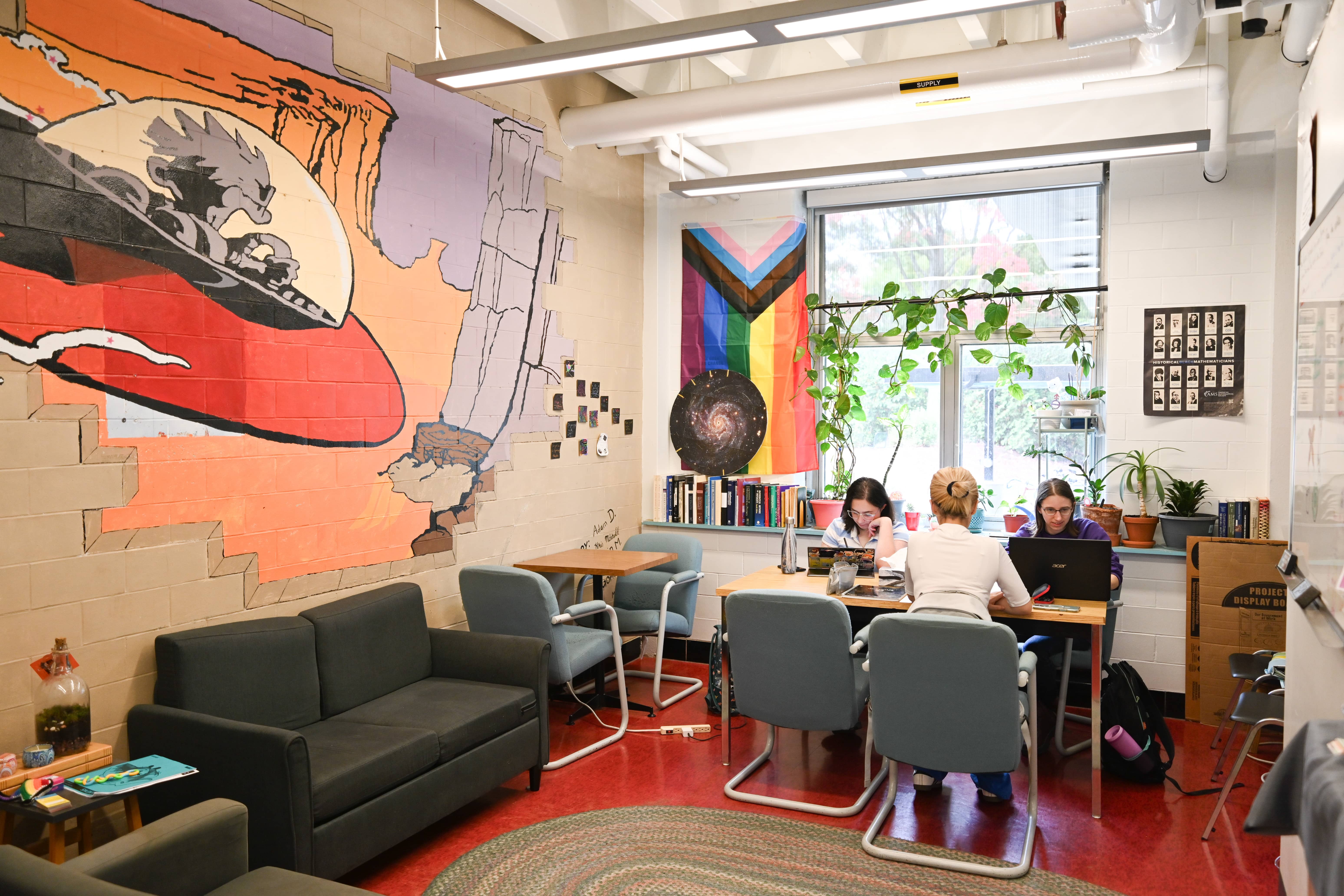 Fem Phys room with four students studying at a table.