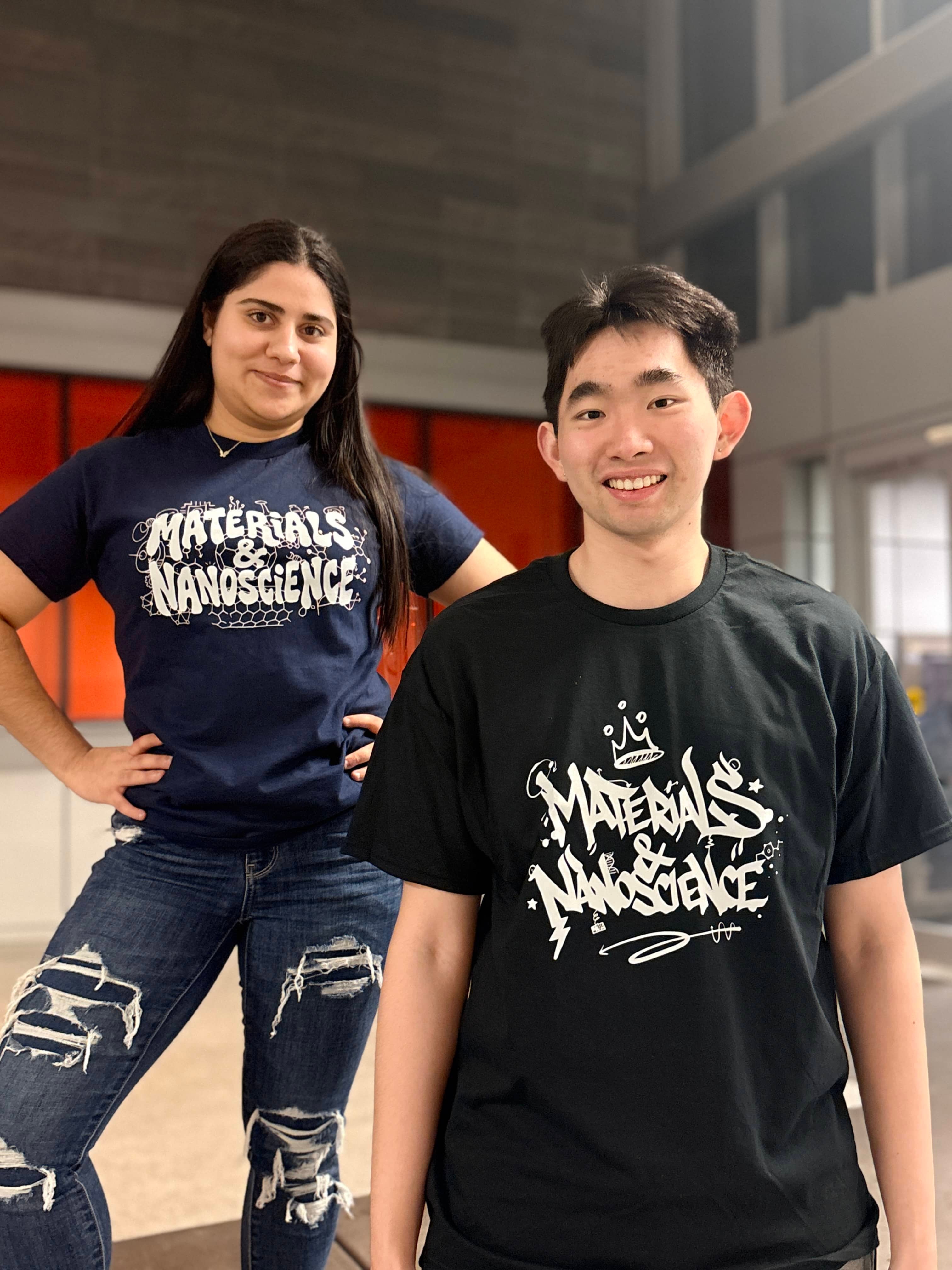 Two students pose wearing Nanoscience t-shirts.