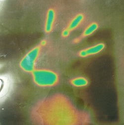 Photograph of hand on LCD sheet