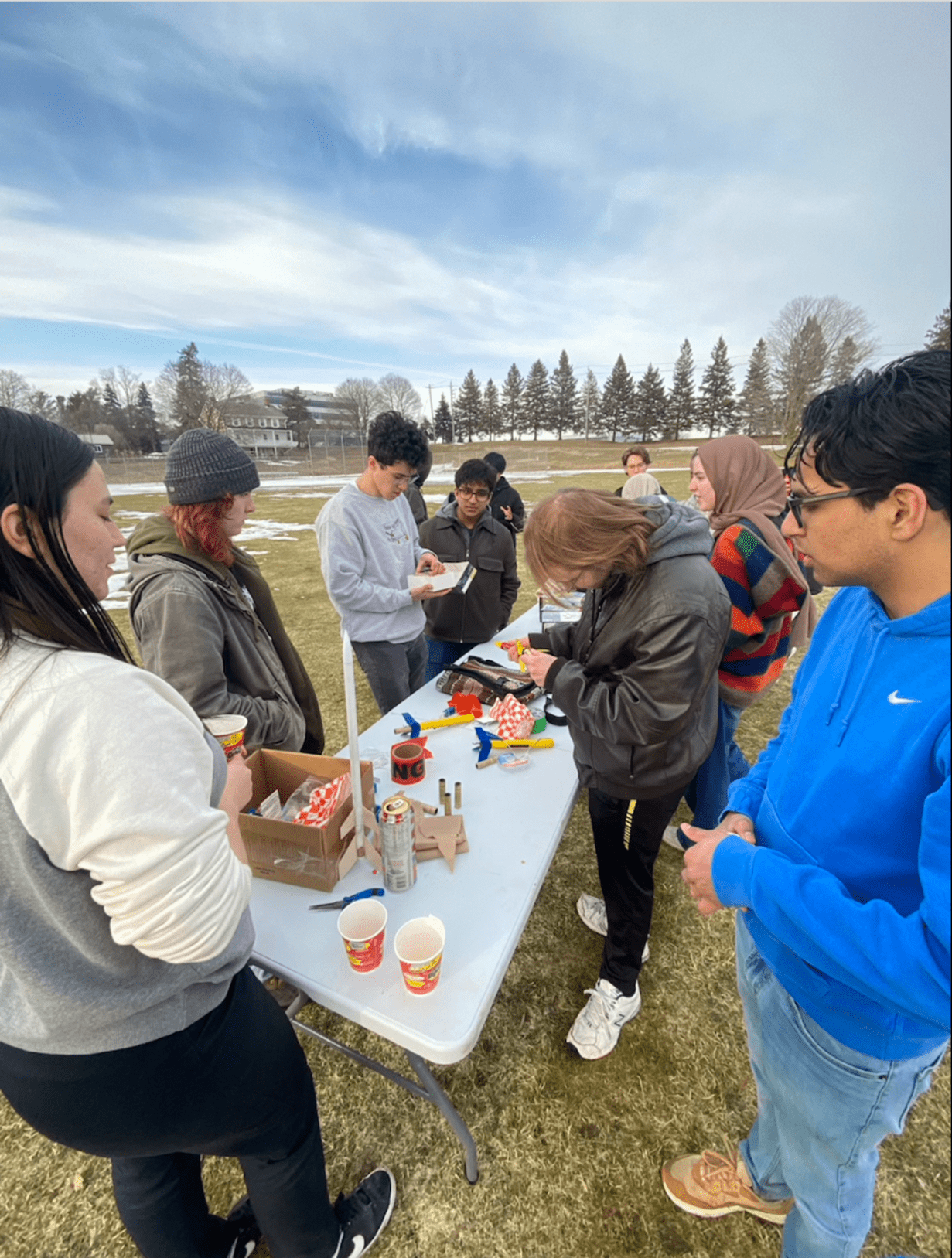 Physics Club students outside at an activity.