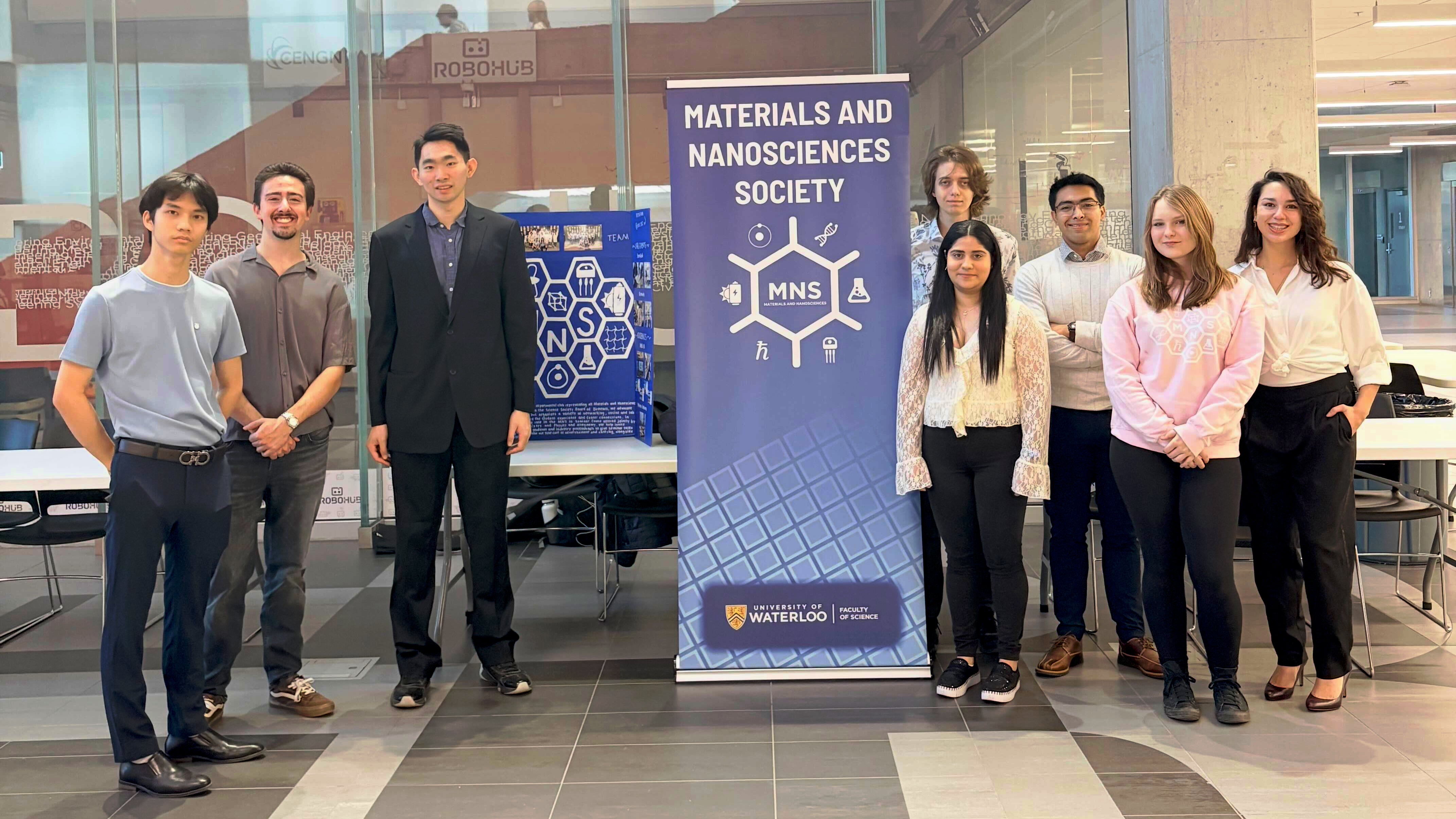 Materials and Nano Society members standing with their club banner.