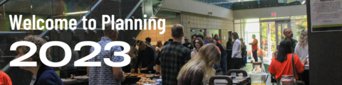 A wide shot of the EV3 Atrium with Welcome to Planning Ceremony attendees.