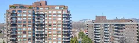 A wide shot of two residential apartment complexes