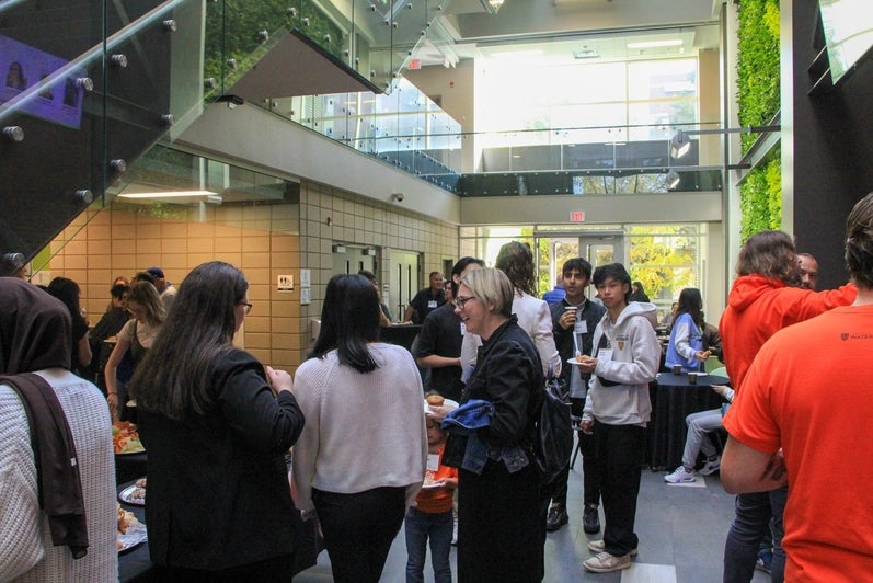 Attendees of the 2023 Welcome to Planning reception being held in the EV3 Atrium.