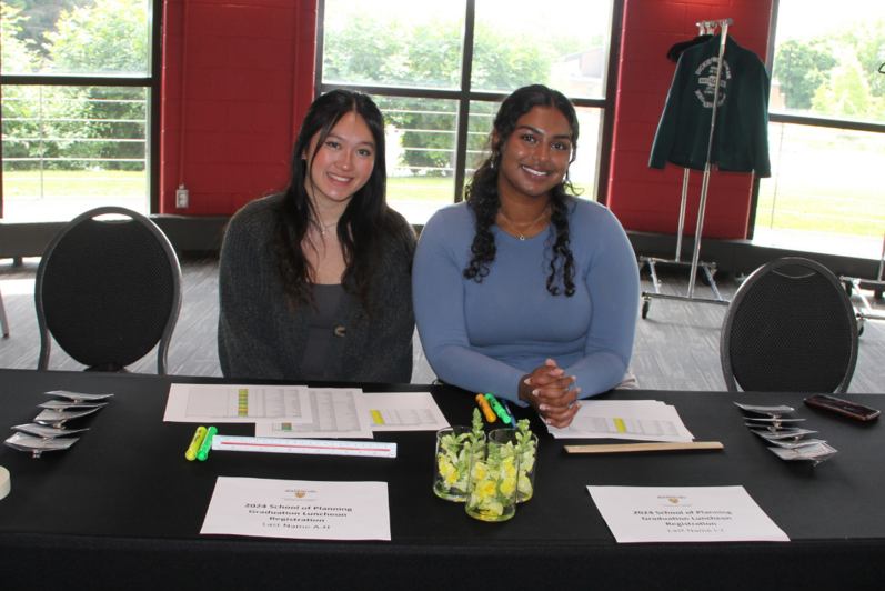 Closeup shot of the registration table run by volunteers Ashvika Mathivannan and Alley Poon