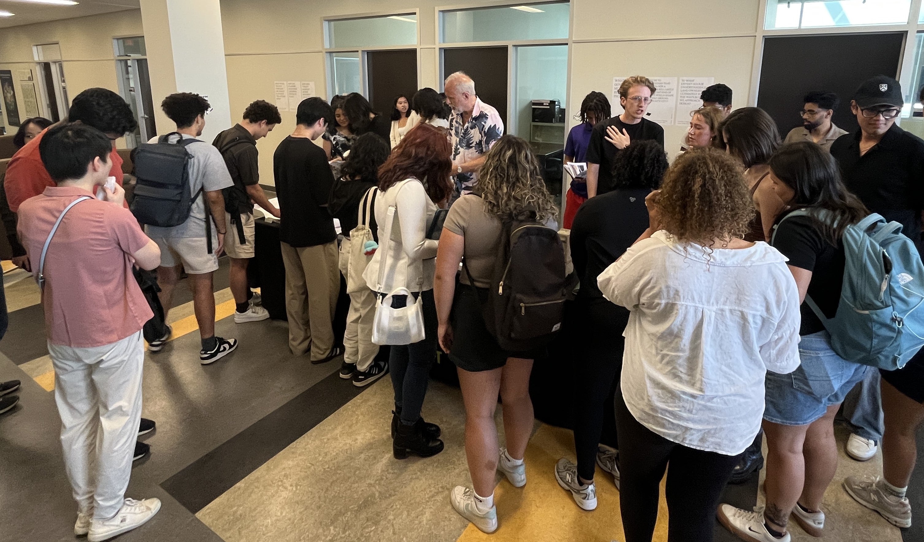 Group of students gathering around a table 