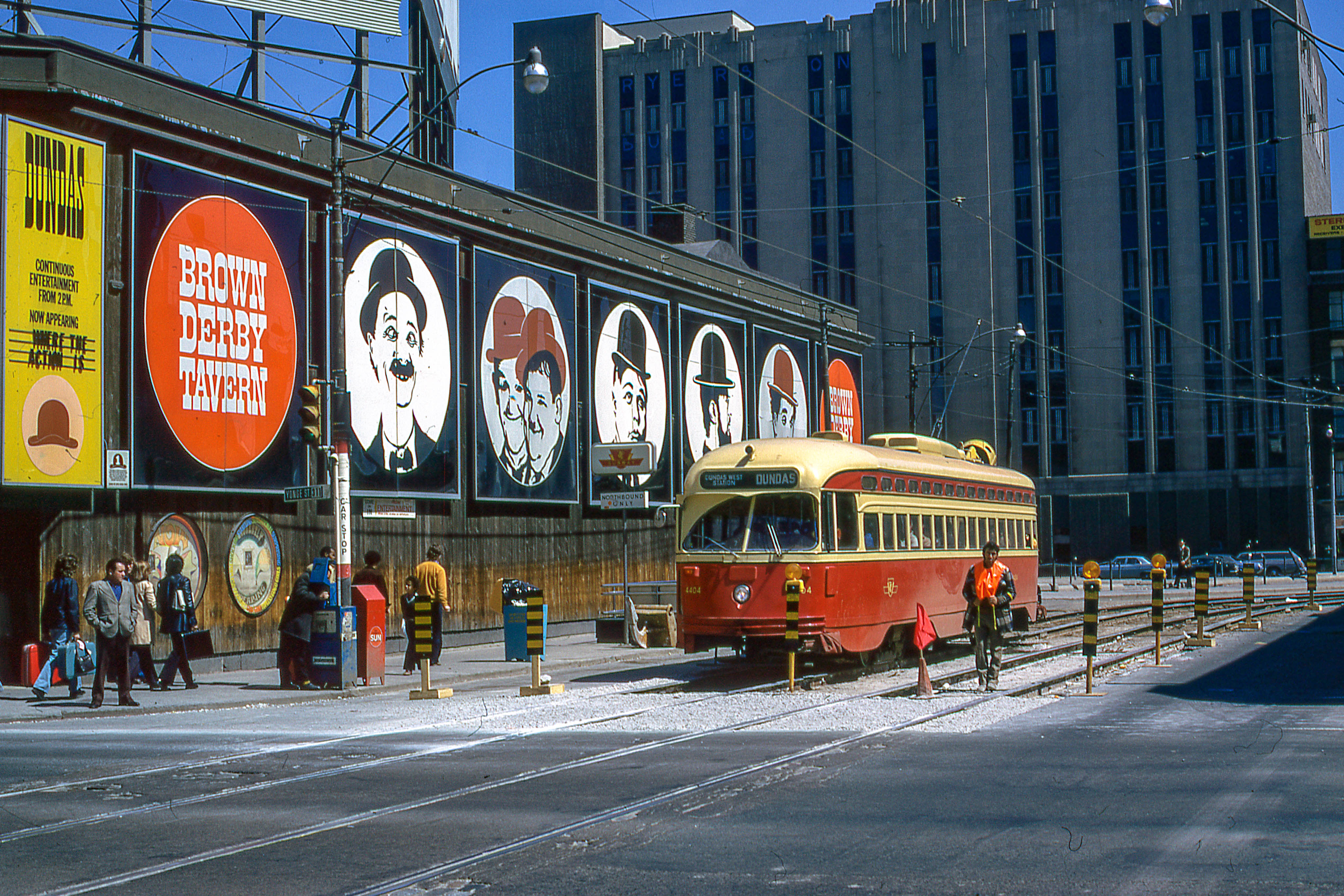 Toronto streetcar pictured by a series of billboards on April 20, 1974.