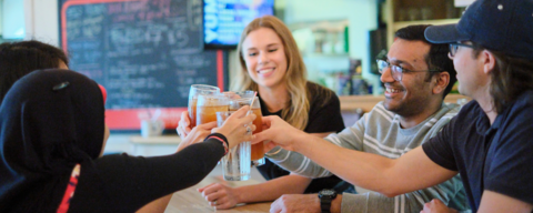 Students cheersing their glasses