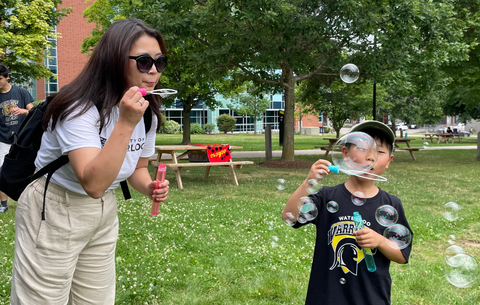 Mother and son at postdoc games event