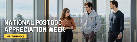 Three postdocs walking down a hall