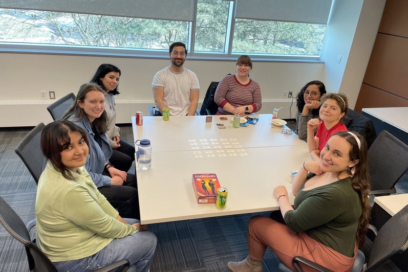A group of people playing codenames