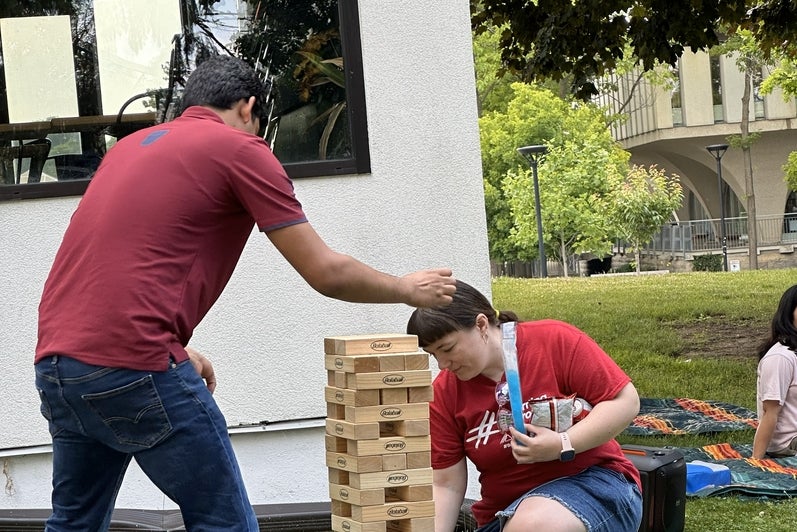 People playing giant jenga