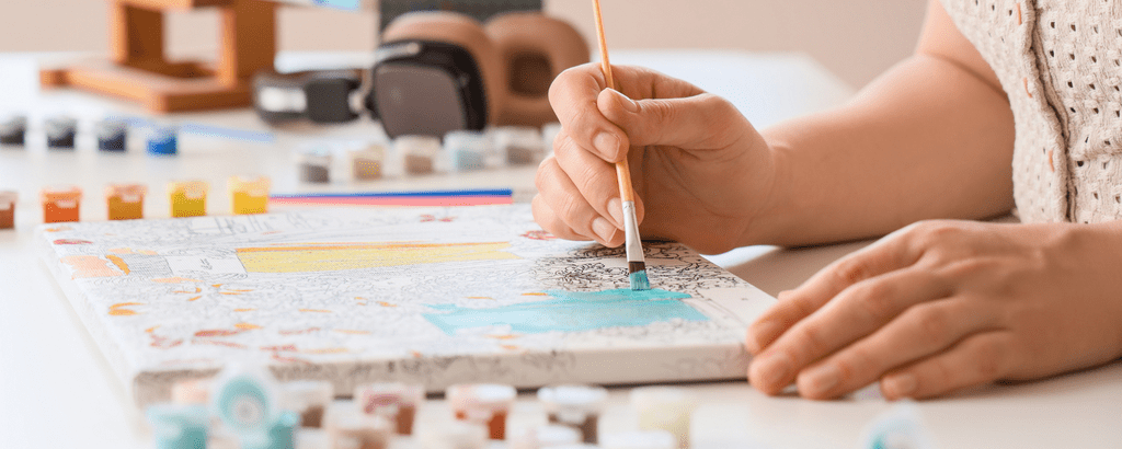 Person doing a paint by number kit