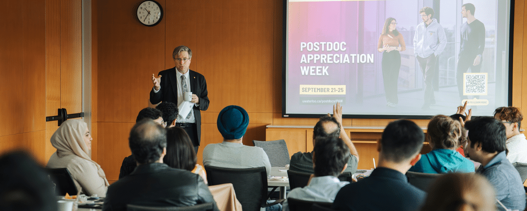 President Bill Rosehart speaking to a group of postdocs
