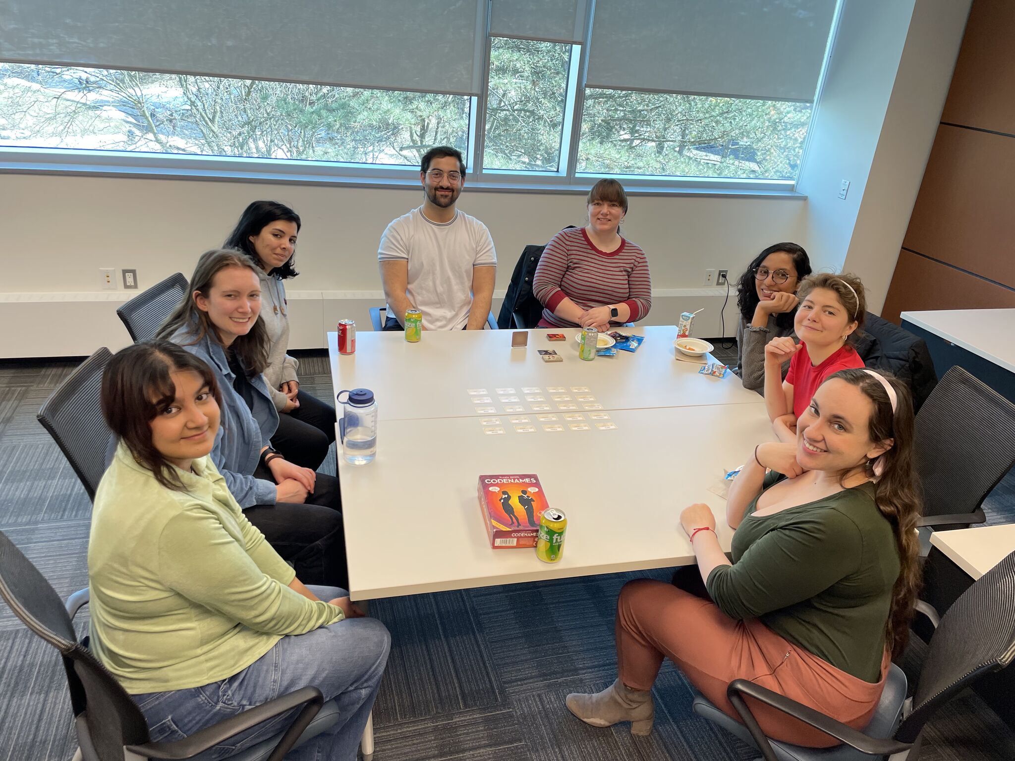 A group of people playing codenames