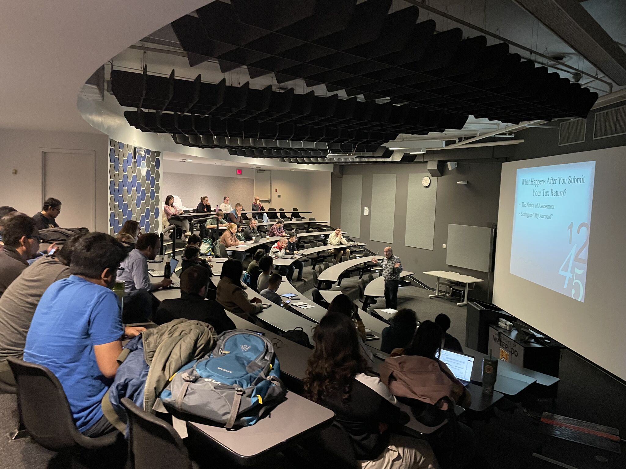 A lecture hall filled with people