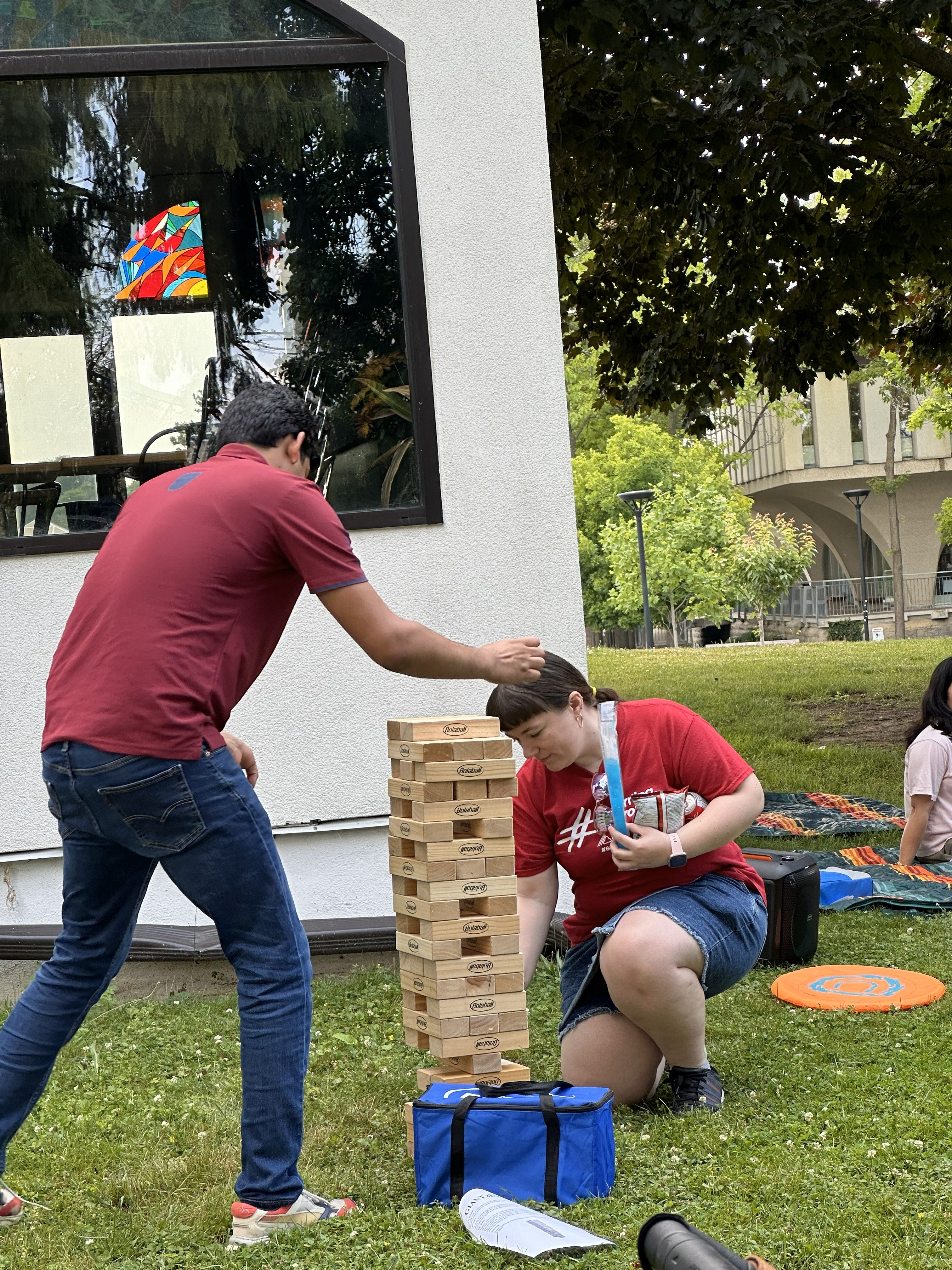 People playing giant jenga