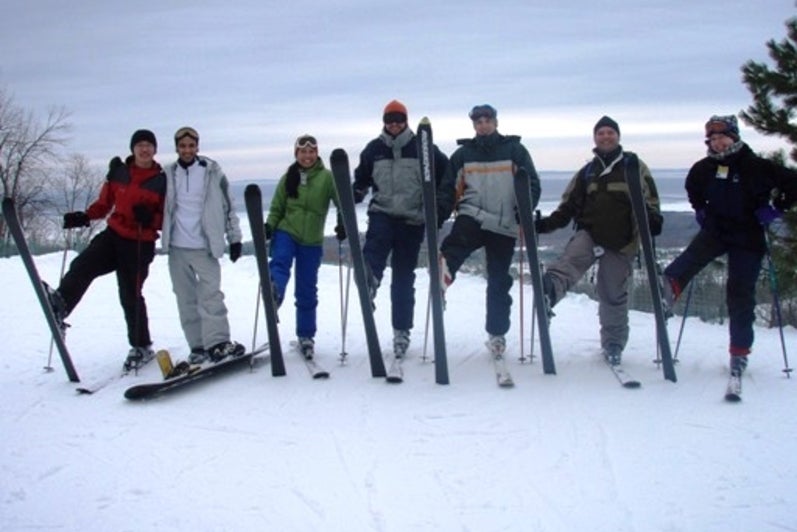 Blue Mountain Ski Resort, March 2008. Seven people standing wearing skis on ski hill.